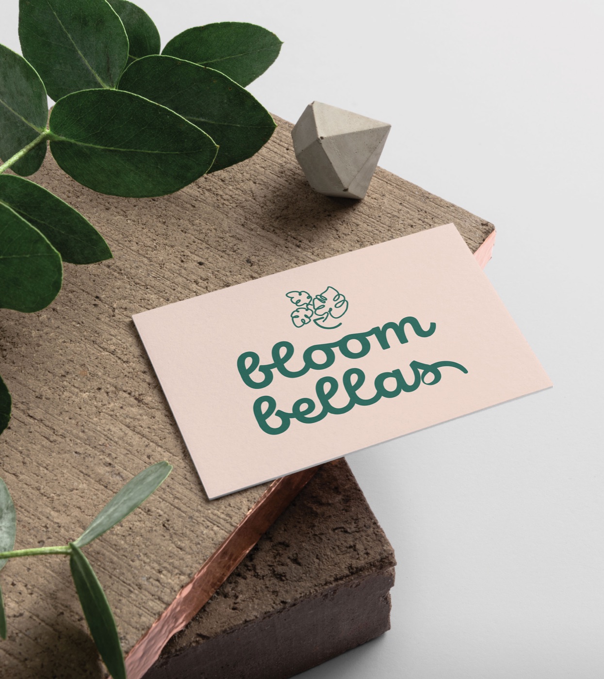 Bloombellas business card mockup with a botanical wordmark.