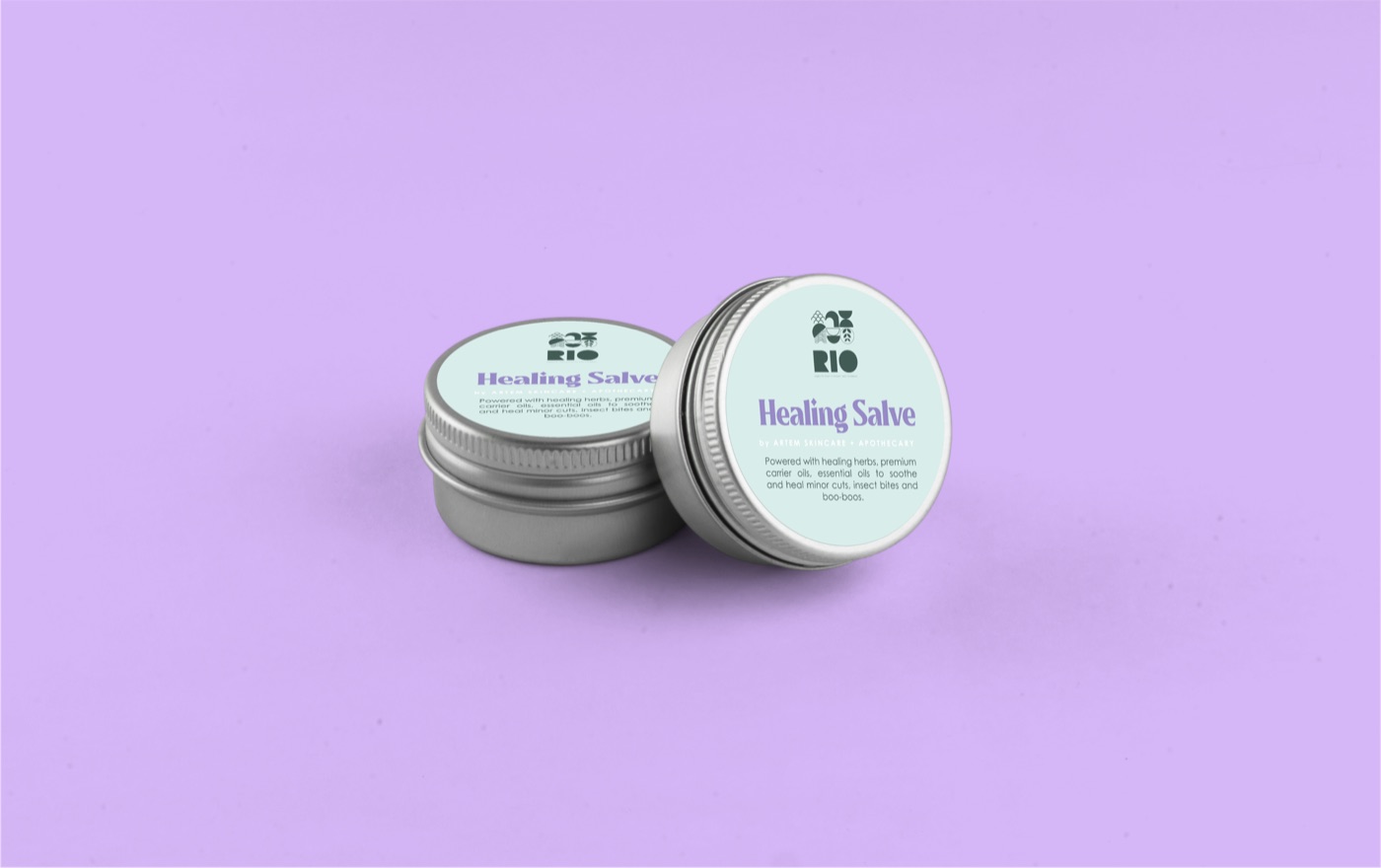 Rio healing salve tins on a lilac background.