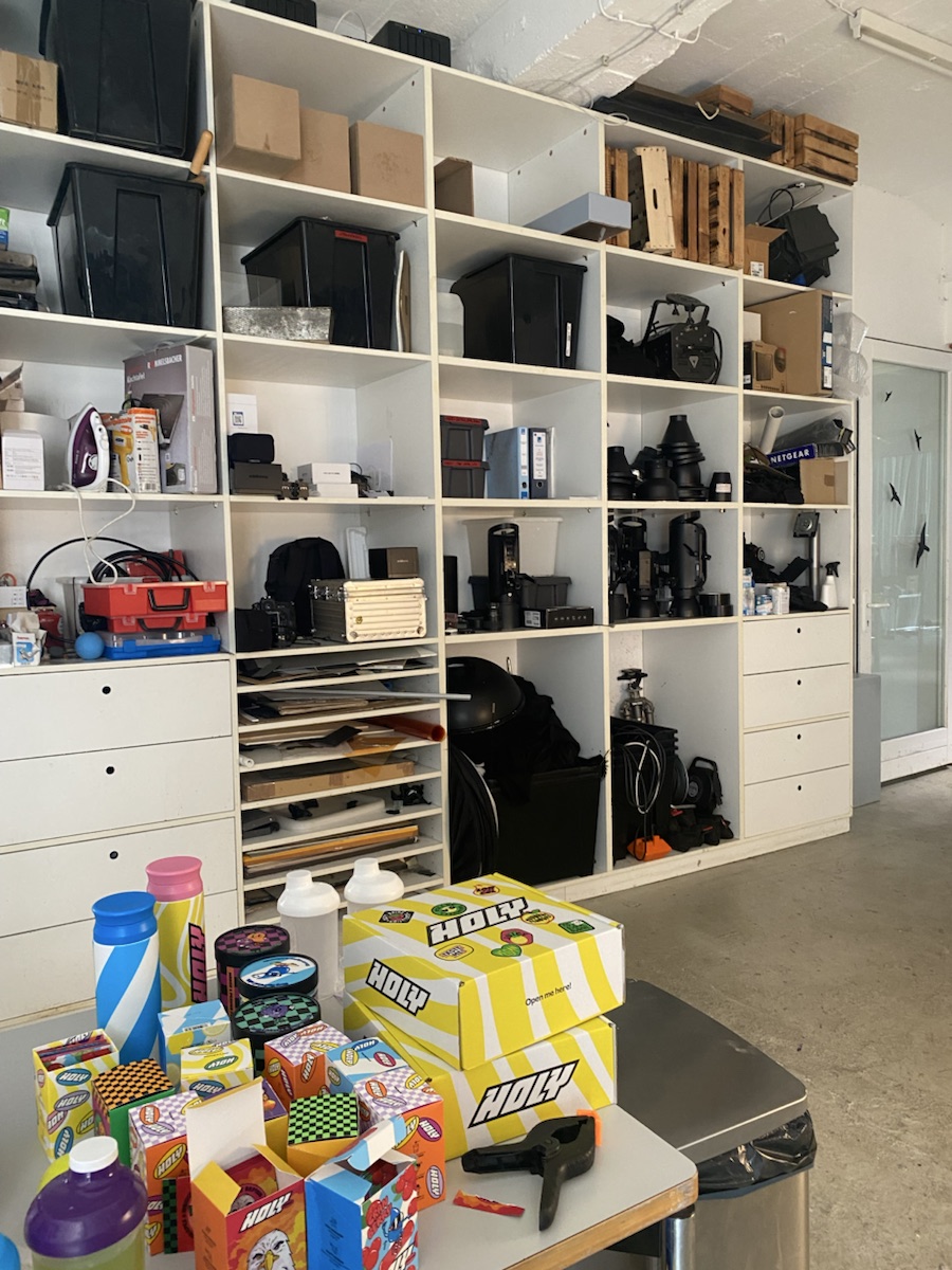 HOLY products, packaging, and props prepared in a photography studio.